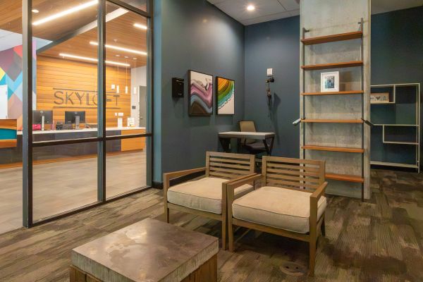 Skyloft Austin social lounge with seating and wall art.